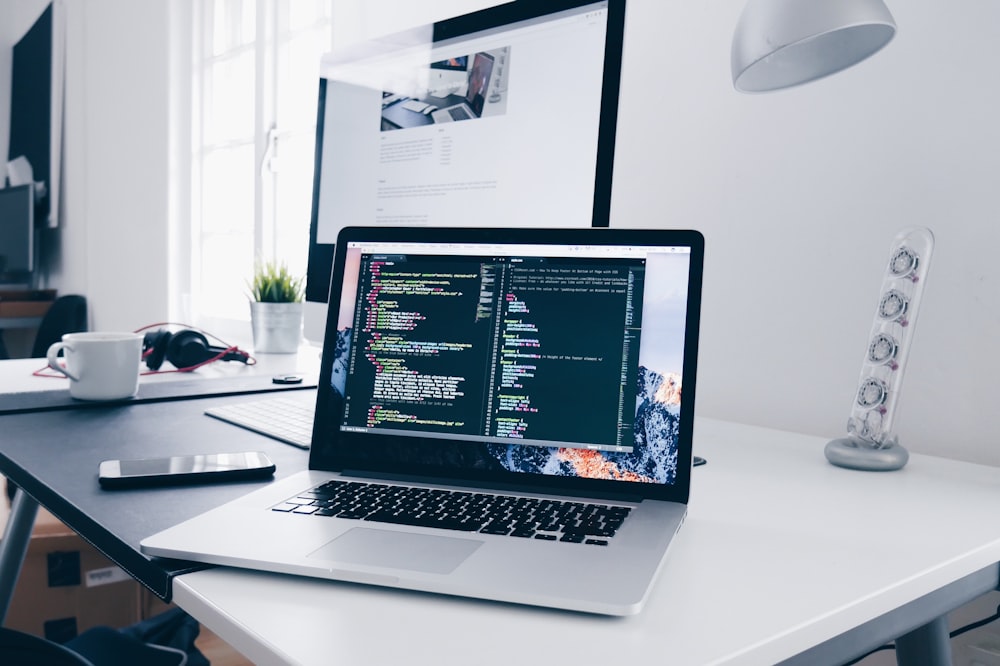 Laptop showing web development code