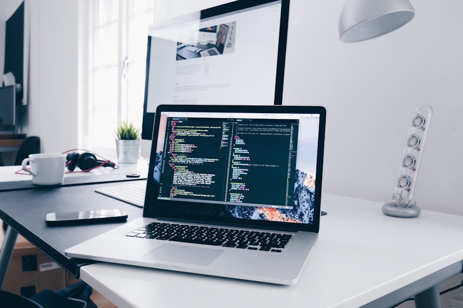 Laptop showing web development code